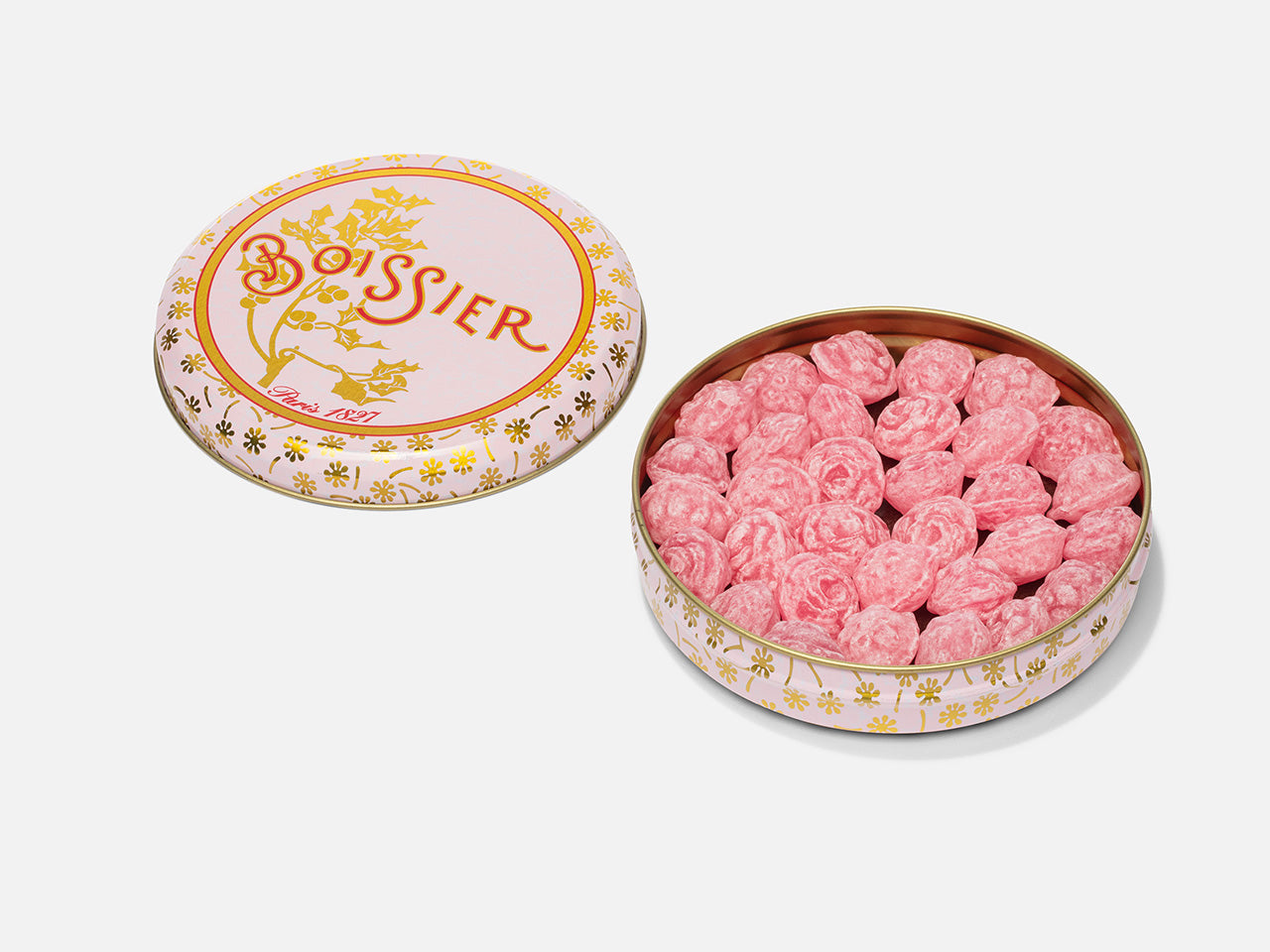 Bonbons à la rose en forme de fleurs dans boîte métal