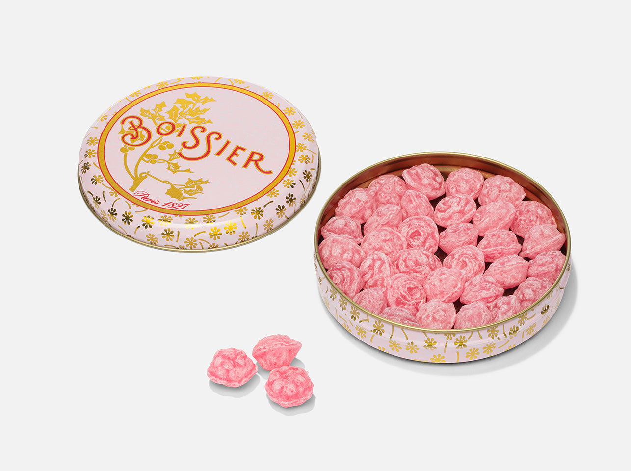 Bonbons à la rose en forme de fleurs dans boîte métal