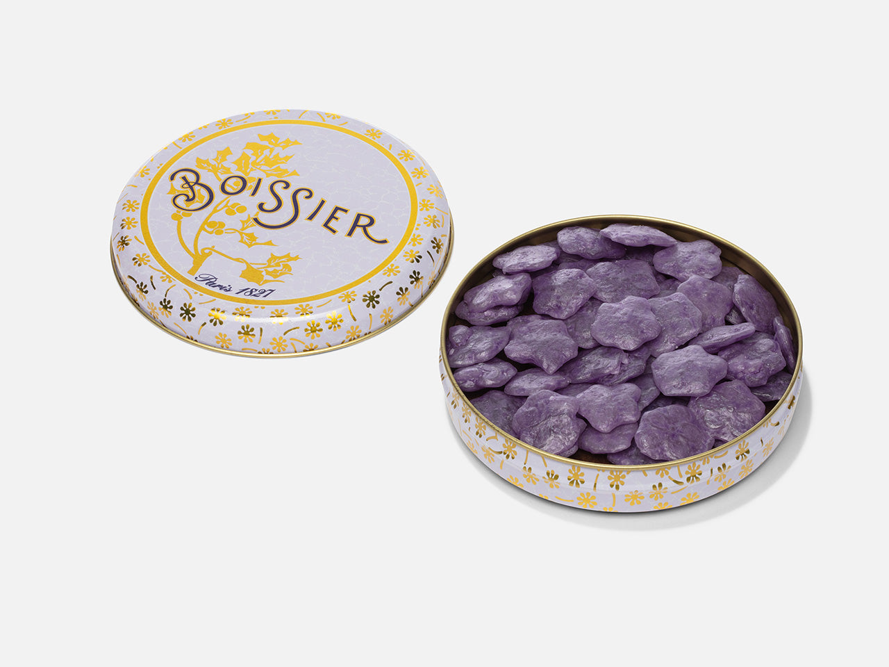 Bonbons d'été à la violette en forme de fleurs dans boîte métal