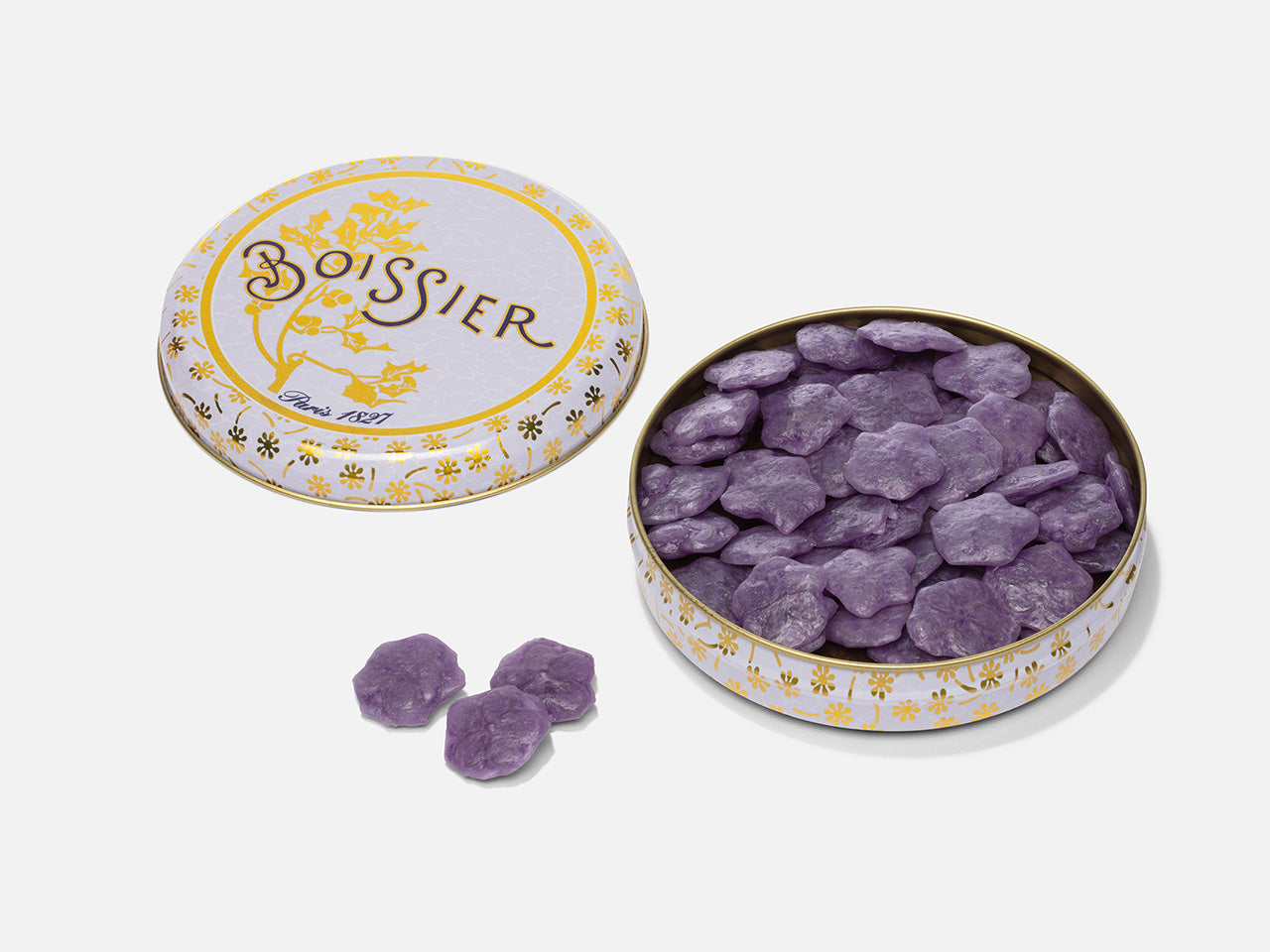 Bonbons d'été à la violette en forme de fleurs dans boîte métal
