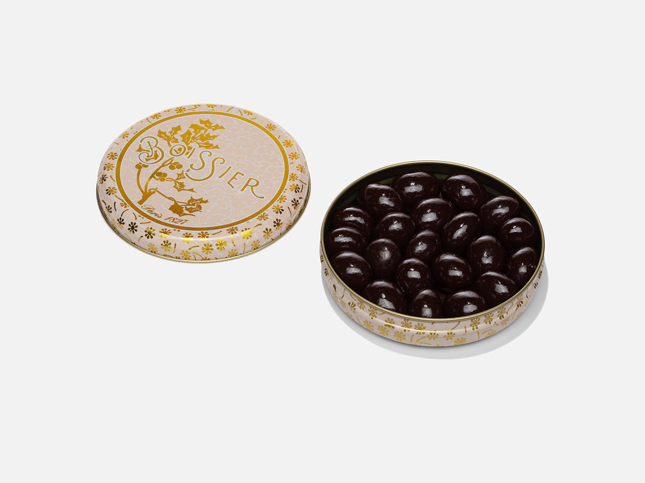 Grains de café au chocolat dans boîte métal beige